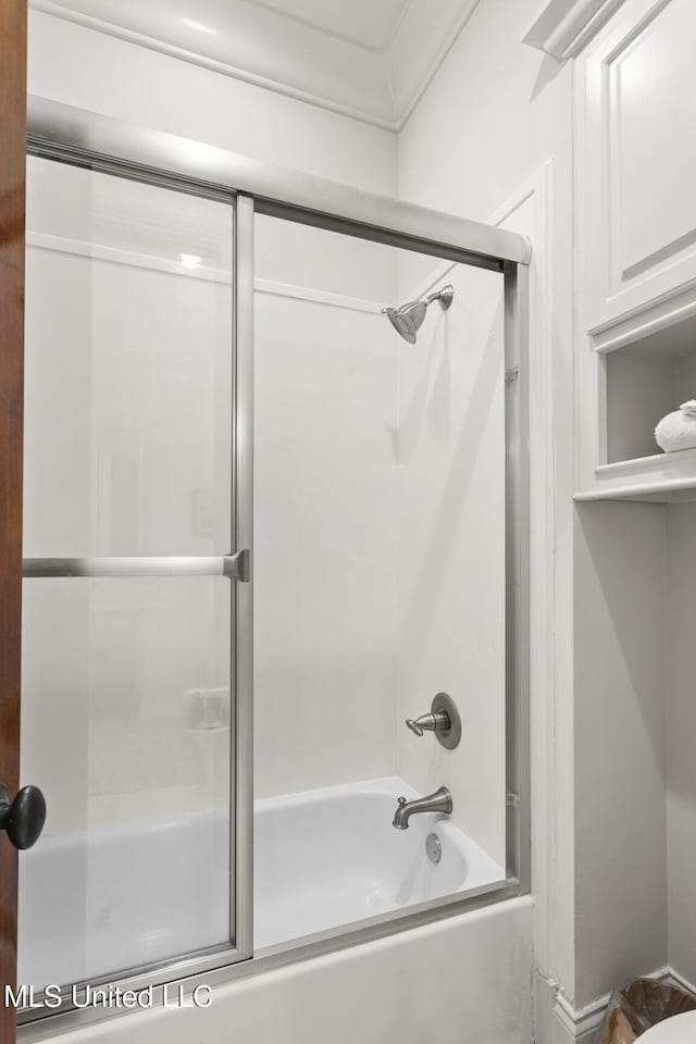 full bathroom featuring bath / shower combo with glass door