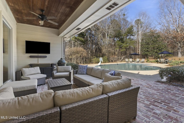 view of patio with an outdoor pool, outdoor lounge area, ceiling fan, and visible vents