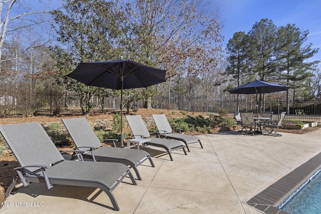 view of patio / terrace featuring fence