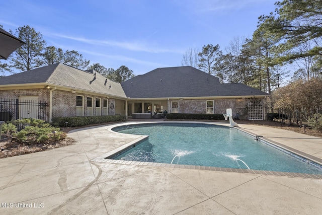 pool featuring a patio and fence