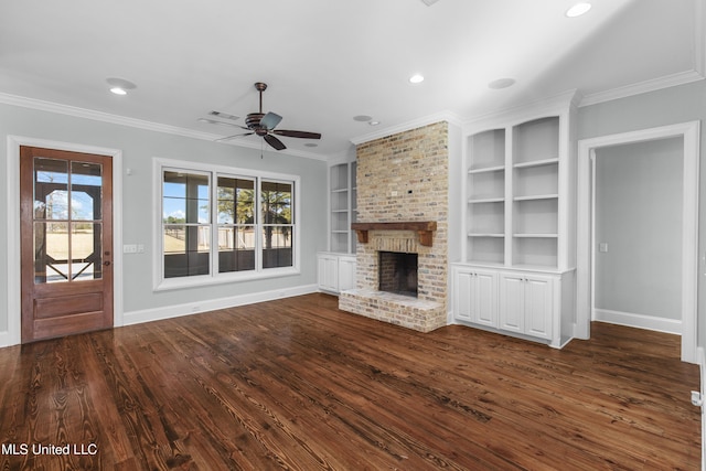 unfurnished living room featuring a fireplace, ornamental molding, ceiling fan, dark wood-type flooring, and built in shelves