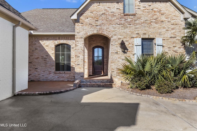 doorway to property with a patio