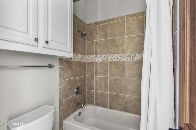 bathroom featuring toilet and shower / bath combo with shower curtain