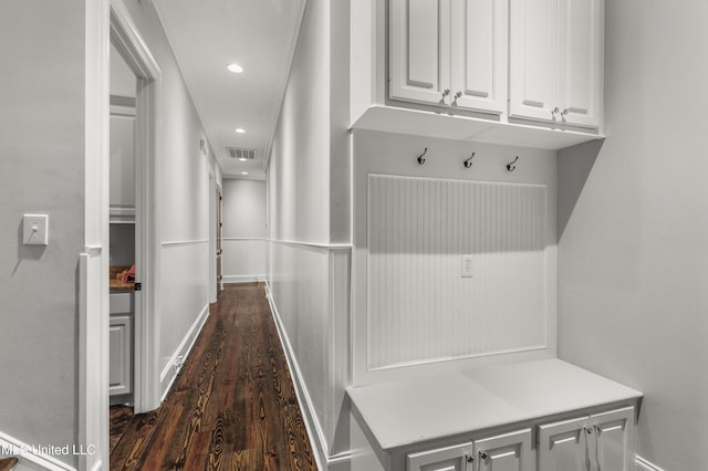 mudroom featuring crown molding and dark hardwood / wood-style floors