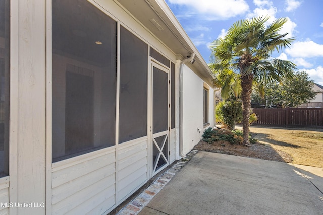 view of property exterior with a patio