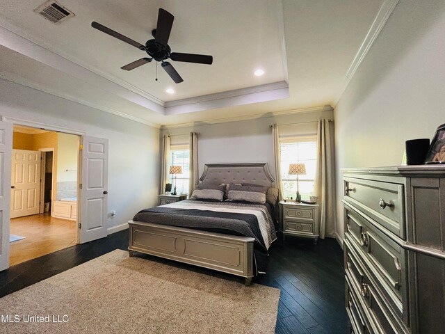 bedroom featuring ceiling fan, multiple windows, dark hardwood / wood-style flooring, and crown molding