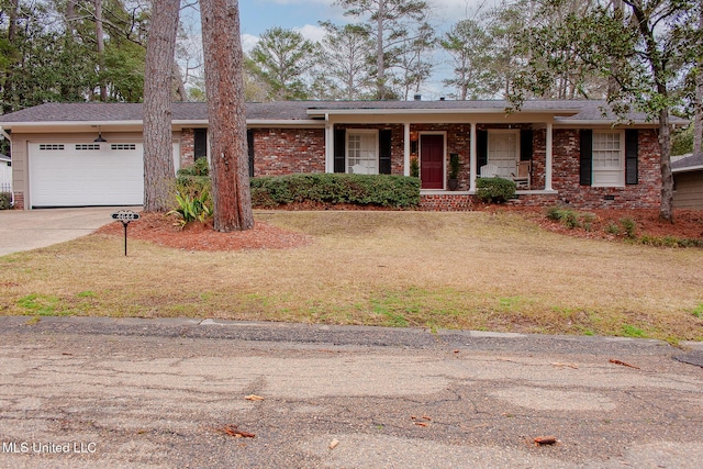 single story home featuring covered porch, a garage, brick siding, concrete driveway, and a front yard