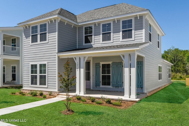 view of front of home featuring a porch and a front yard