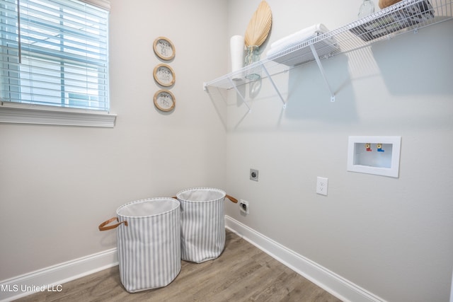 clothes washing area with washer hookup, electric dryer hookup, and wood-type flooring