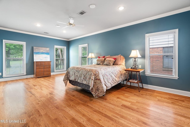 bedroom with ornamental molding, baseboards, wood finished floors, recessed lighting, and a ceiling fan