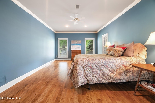 bedroom featuring wood finished floors, baseboards, ornamental molding, recessed lighting, and a ceiling fan