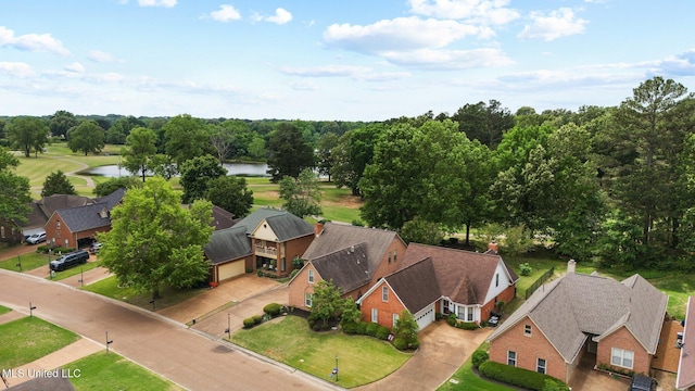 aerial view of residential area with a large body of water