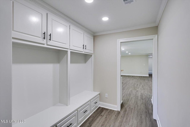 mudroom featuring hardwood / wood-style floors and crown molding