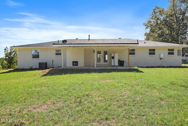 back of house featuring a yard, cooling unit, and french doors