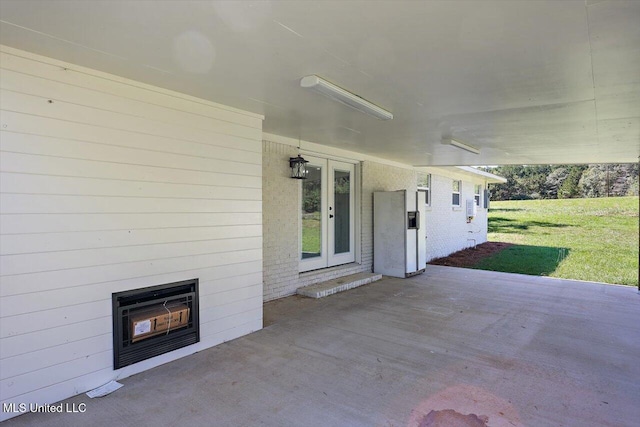 view of patio / terrace with french doors and heating unit