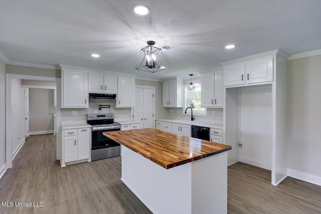 kitchen with stainless steel electric range, a center island, white cabinets, black dishwasher, and butcher block countertops