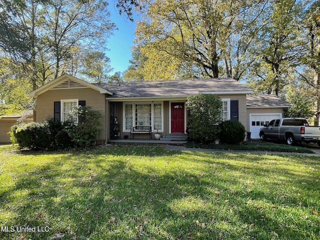 single story home featuring a front yard and a garage