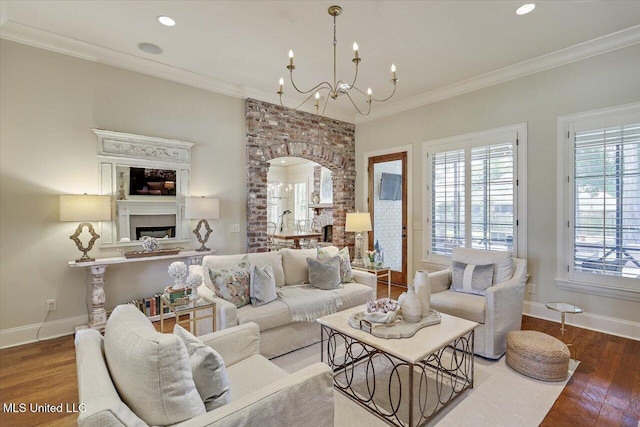 215 Grayhawk Dr, Madison, MS 39110 - living room with wood finished floors, recessed lighting, a fireplace, ornamental molding, and a chandelier