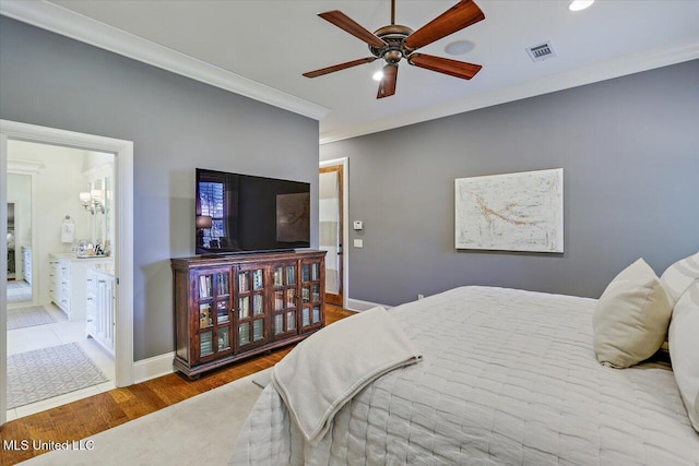 215 Grayhawk Dr, Madison, MS 39110 - bedroom with wood finished floors, ornamental molding, connected bathroom, and ceiling fan