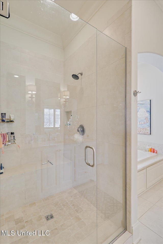 215 Grayhawk Dr, Madison, MS 39110 - full bathroom featuring a stall shower, a garden tub, and tile patterned flooring