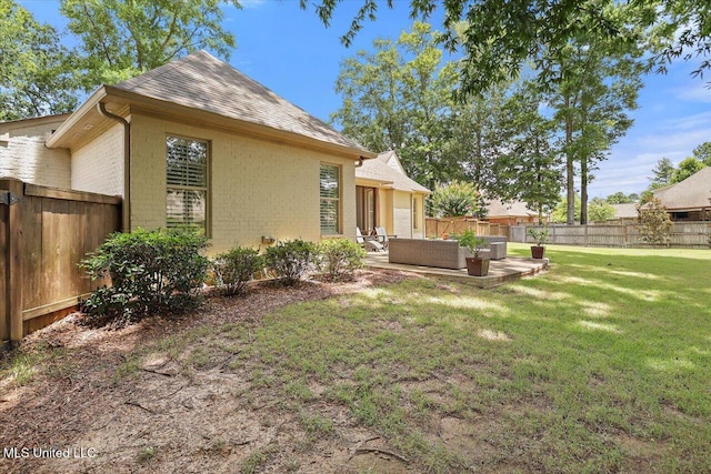 215 Grayhawk Dr, Madison, MS 39110 - fenced backyard with outdoor lounge area and a patio area