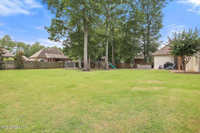 215 Grayhawk Dr, Madison, MS 39110 - fenced backyard with a playground