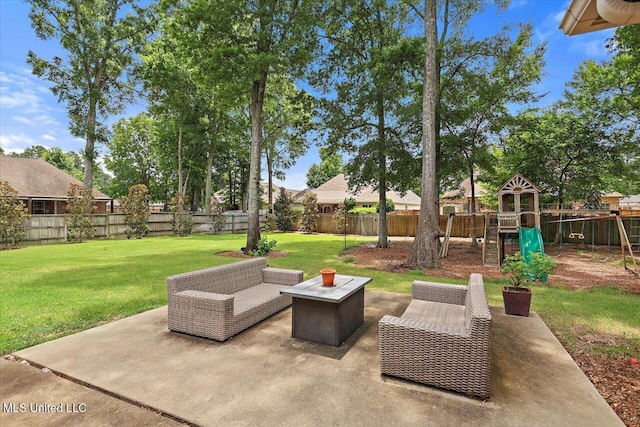215 Grayhawk Dr, Madison, MS 39110 - fenced backyard featuring a playground and a patio area