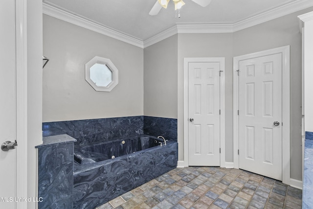 bathroom featuring ornamental molding, a tub, and ceiling fan