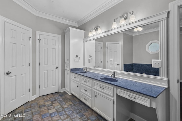 bathroom featuring vanity and ornamental molding