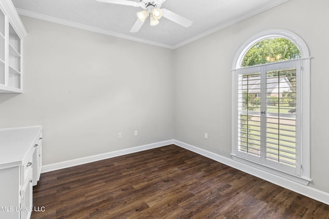 unfurnished room with crown molding, ceiling fan, and dark hardwood / wood-style flooring