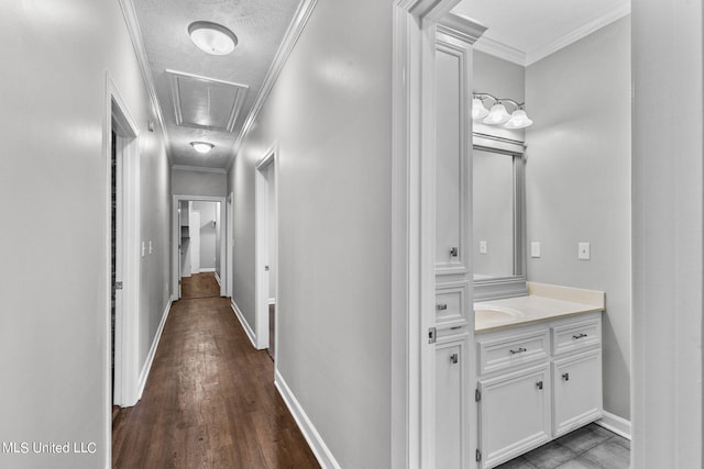 hall featuring ornamental molding and dark wood-type flooring