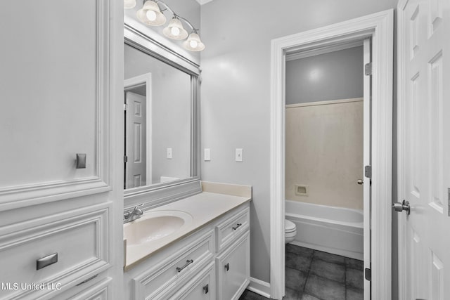 bathroom featuring vanity, toilet, and tile patterned flooring