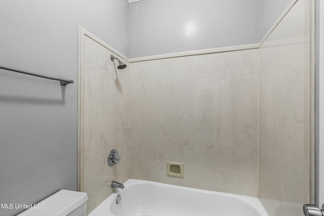 bathroom with toilet and tub / shower combination