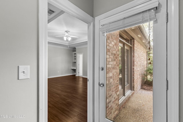 hallway with ornamental molding and hardwood / wood-style flooring