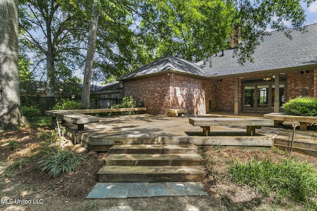 rear view of house with french doors and a deck