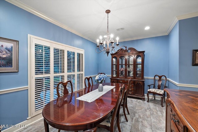 dining area with crown molding and a chandelier