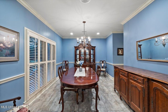 dining room featuring ornamental molding and a chandelier