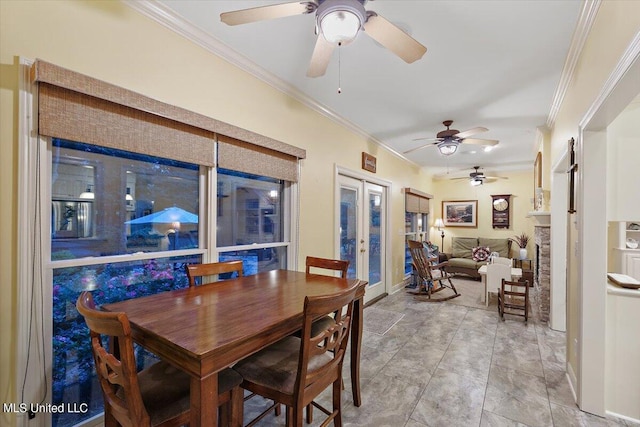 dining room featuring baseboards, french doors, ornamental molding, and ceiling fan