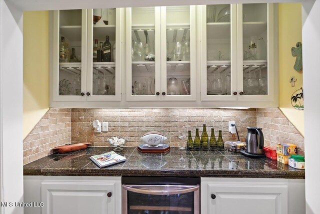 bar with tasteful backsplash, a bar, and wine cooler