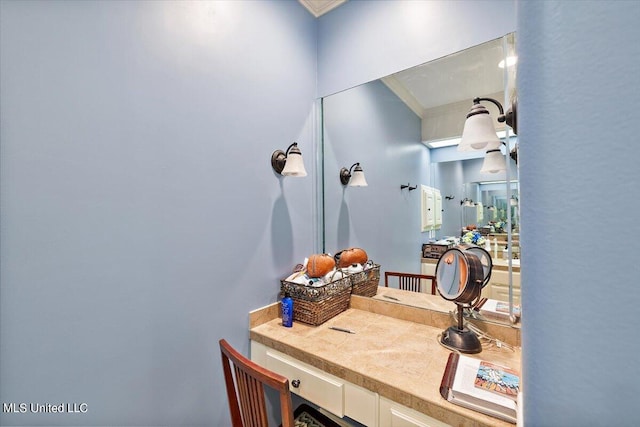 bathroom with vanity and crown molding