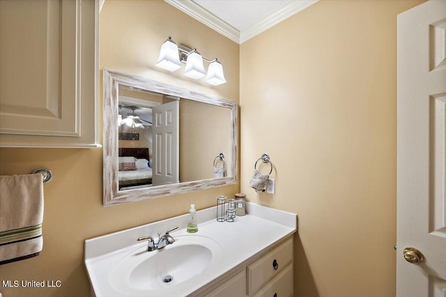 bathroom with crown molding and vanity
