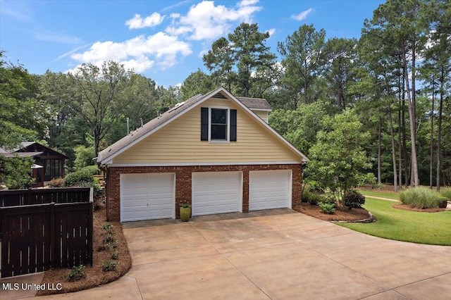 garage featuring fence