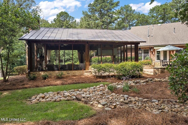 exterior space featuring a sunroom