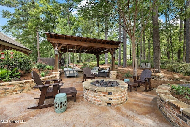 view of patio featuring a pergola and an outdoor fire pit