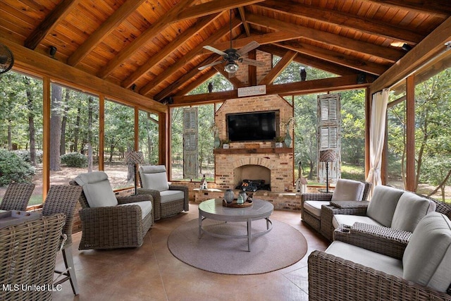 sunroom / solarium featuring beamed ceiling