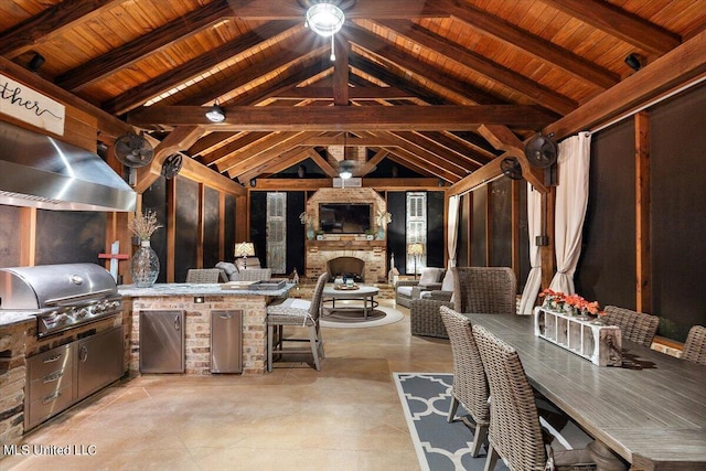 view of patio / terrace with an outdoor kitchen, an outdoor fireplace, grilling area, outdoor dining area, and a gazebo
