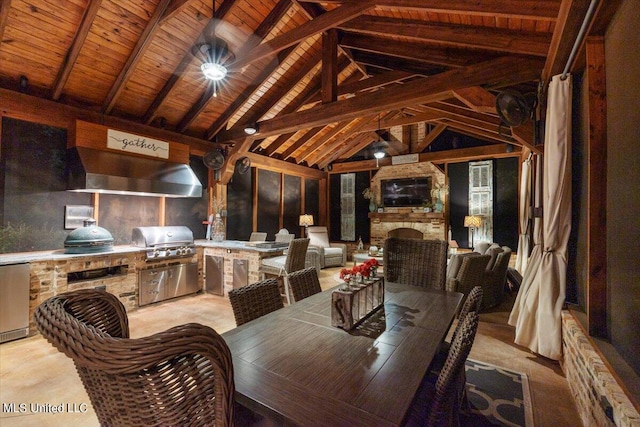 interior space with wood ceiling, an outdoor stone fireplace, and vaulted ceiling with beams