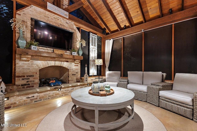 living area featuring wooden ceiling, vaulted ceiling with beams, and an outdoor brick fireplace