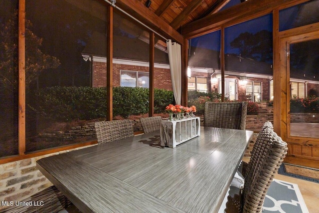 sunroom with beamed ceiling