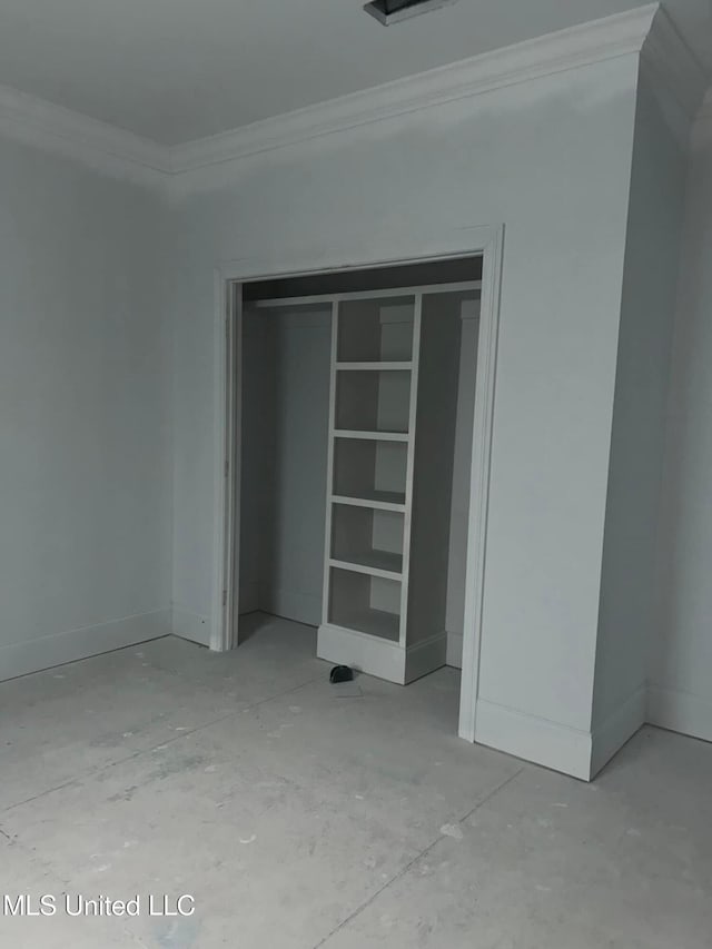 13146 Carrolton St, Biloxi, MS 39532 - unfurnished bedroom featuring a closet and crown molding